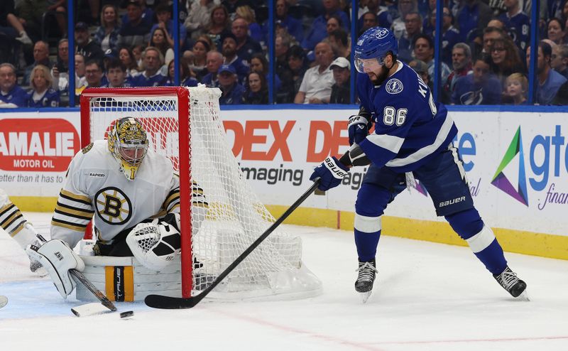 Nov 20, 2023; Tampa, Florida, USA; Tampa Bay Lightning right wing Nikita Kucherov (86) shoots as Boston Bruins goaltender Jeremy Swayman (1) defends during the first period at Amalie Arena. Mandatory Credit: Kim Klement Neitzel-USA TODAY Sports