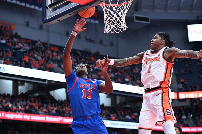 Feb 14, 2026; Syracuse, New York, USA; Southern Methodist University Mustangs center Jaden Toombs (10) goes for a lay up with Syracuse Orange forward Donnie Freeman (1) defending in the first half at the JMA Wireless Dome. Mandatory Credit: Mark Konezny-Imagn Images