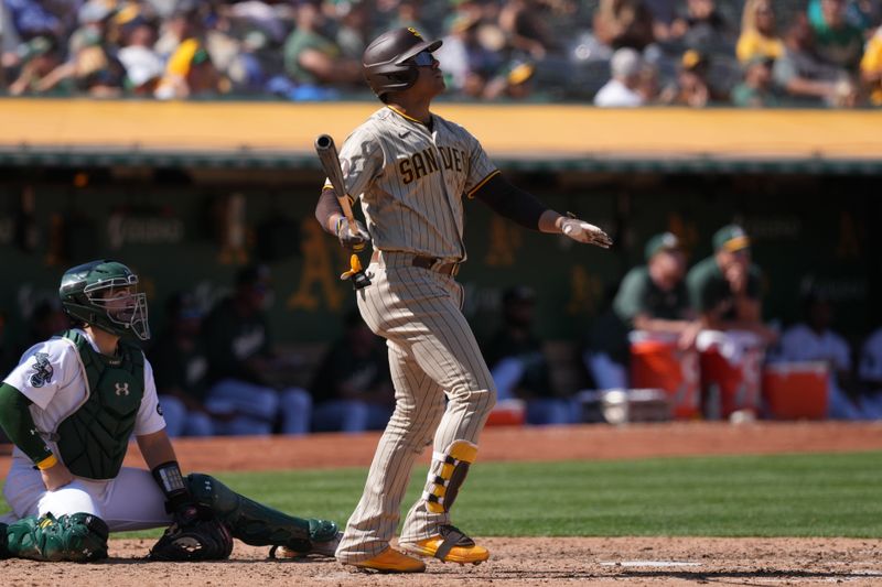 Sep 17, 2023; Oakland, California, USA; San Diego Padres left fielder Juan Soto (22) watches the flight of his home run against the Oakland Athletics during the seventh inning at Oakland-Alameda County Coliseum. Mandatory Credit: Darren Yamashita-USA TODAY Sports