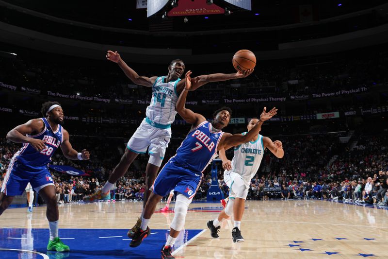 PHILADELPHIA, PA - NOVEMBER 10: Moussa Diabate #14 of the Charlotte Hornets rebounds the ball during the game against the Philadelphia 76ers on November 10, 2024 at the Wells Fargo Center in Philadelphia, Pennsylvania NOTE TO USER: User expressly acknowledges and agrees that, by downloading and/or using this Photograph, user is consenting to the terms and conditions of the Getty Images License Agreement. Mandatory Copyright Notice: Copyright 2024 NBAE (Photo by Jesse D. Garrabrant/NBAE via Getty Images)