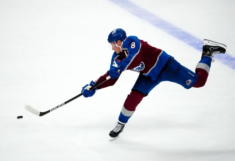 Oct 12, 2022; Denver, Colorado, USA; Colorado Avalanche defenseman Cale Makar (8) shoots the puck in the third period against the Chicago Blackhawks at Ball Arena. Mandatory Credit: Ron Chenoy-USA TODAY Sports