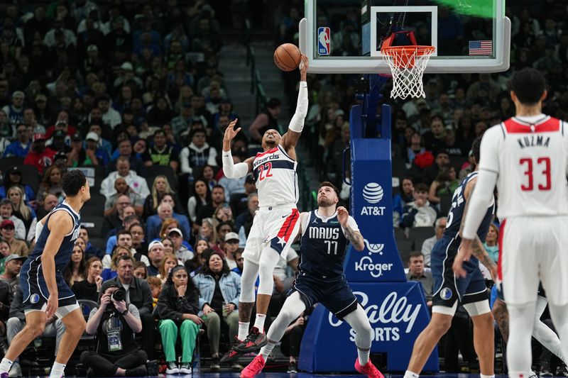 DALLAS, TX - FEBRUARY 12: Monte Morris #22 of the Washington Wizards reaches for the ball during the game against the Dallas Mavericks on February 12, 2024 at the American Airlines Center in Dallas, Texas. NOTE TO USER: User expressly acknowledges and agrees that, by downloading and or using this photograph, User is consenting to the terms and conditions of the Getty Images License Agreement. Mandatory Copyright Notice: Copyright 2024 NBAE (Photo by Glenn James/NBAE via Getty Images)