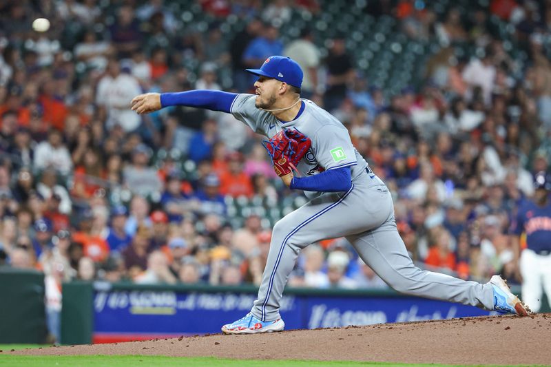 Apr 2, 2024; Houston, Texas, USA; Toronto Blue Jays starting pitcher Jose Berrios (17) delivers a pitch during the first inning against the Houston Astros at Minute Maid Park. Mandatory Credit: Troy Taormina-USA TODAY Sports