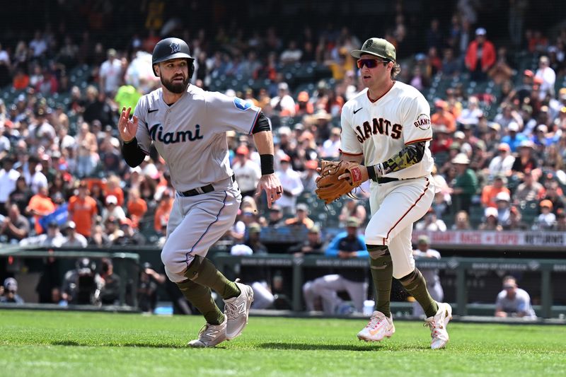 May 21, 2023; San Francisco, California, USA; San Francisco Giants infielder Casey Schmitt (6) chases Miami Marlins infielder Jon Berti (5) in a rundown play during the fifth inning at Oracle Park. Mandatory Credit: Robert Edwards-USA TODAY Sports