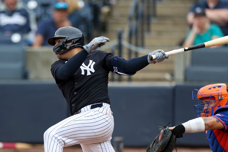 Mar 22, 2024; Tampa, Florida, USA;  New York Yankees catcher Jose Trevino (39) hits an rbi single against the New York Mets in the fourth inning at George M. Steinbrenner Field. Mandatory Credit: Nathan Ray Seebeck-USA TODAY Sports