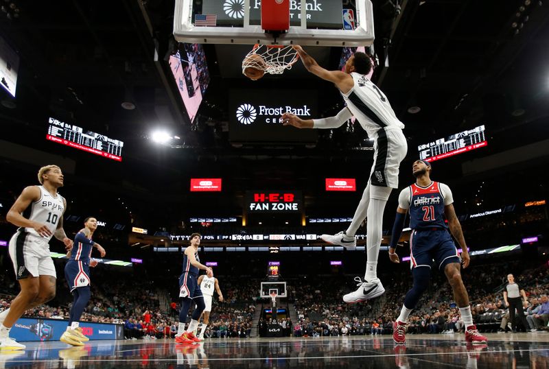 SAN ANTONIO, TX - JANUARY  29:  Victor Wembanyama #1 of the San Antonio Spurs dunks against the Washington Wizards in the first half at Frost Bank Center on January 29, 2024 in San Antonio, Texas. NOTE TO USER: User expressly acknowledges and agrees that, by downloading and or using this photograph, User is consenting to terms and conditions of the Getty Images License Agreement. (Photo by Ronald Cortes/Getty Images)