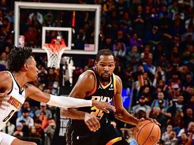 PHOENIX, AZ - DECEMBER 1: Kevin Durant #35 of the Phoenix Suns dribbles the ball during the game against the Denver Nuggets on December 1, 2023 at Footprint Center in Phoenix, Arizona. NOTE TO USER: User expressly acknowledges and agrees that, by downloading and or using this photograph, user is consenting to the terms and conditions of the Getty Images License Agreement. Mandatory Copyright Notice: Copyright 2023 NBAE (Photo by Barry Gossage/NBAE via Getty Images)