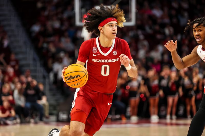 Feb 4, 2023; Columbia, South Carolina, USA; Arkansas Razorbacks guard Anthony Black (0) drives against the South Carolina Gamecocks in the first half at Colonial Life Arena. Mandatory Credit: Jeff Blake-USA TODAY Sports