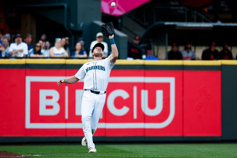 Jul 2, 2024; Seattle, Washington, USA; Seattle Mariners left fielder Luke Raley (20) catches a fly ball against the Baltimore Orioles during the fourth inning at T-Mobile Park. Mandatory Credit: Joe Nicholson-USA TODAY Sports