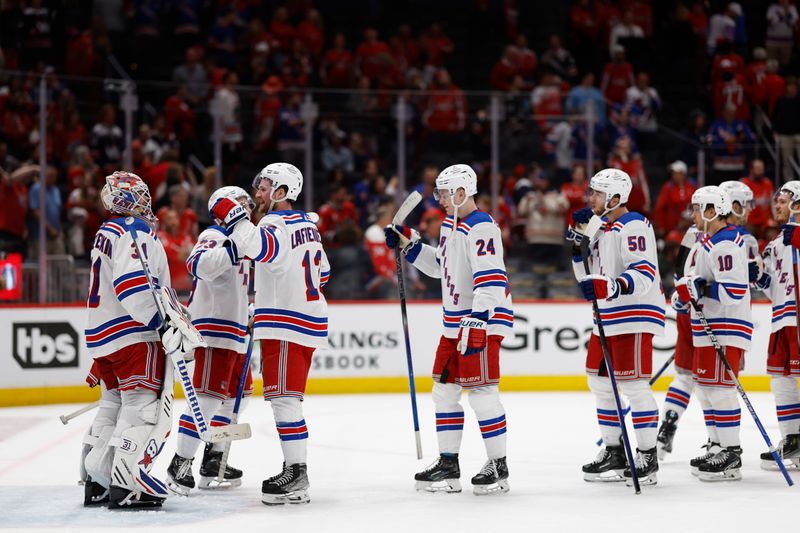 Apr 28, 2024; Washington, District of Columbia, USA; New York Rangers players celebrate after their game against the Washington Capitals in game four of the first round of the 2024 Stanley Cup Playoffs at Capital One Arena. Mandatory Credit: Geoff Burke-USA TODAY Sports