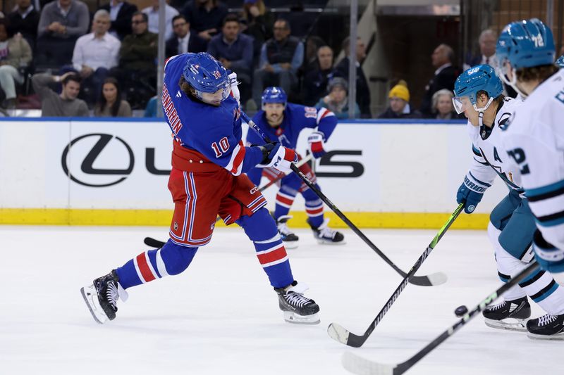 Nov 14, 2024; New York, New York, USA; New York Rangers left wing Artemi Panarin (10) takes a shot against the San Jose Sharks during the third period at Madison Square Garden. Mandatory Credit: Brad Penner-Imagn Images