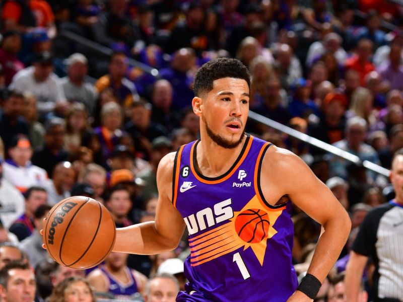 PHOENIX, AZ - OCTOBER 25: Devin Booker #1 of the Phoenix Suns drives to the basket during the game against the Golden State Warriors on October 25, 2022 at Footprint Center in Phoenix, Arizona. NOTE TO USER: User expressly acknowledges and agrees that, by downloading and or using this photograph, user is consenting to the terms and conditions of the Getty Images License Agreement. Mandatory Copyright Notice: Copyright 2022 NBAE (Photo by Barry Gossage/NBAE via Getty Images)