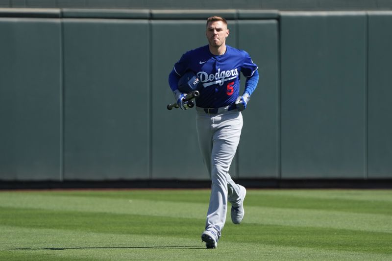 Feb 27, 2025; Salt River Pima-Maricopa, Arizona, USA; Los Angeles Dodgers first base Freddie Freeman (5) arrives before a spring training game against the Colorado Rockies at Salt River Fields at Talking Stick. Mandatory Credit: Rick Scuteri-Imagn Images