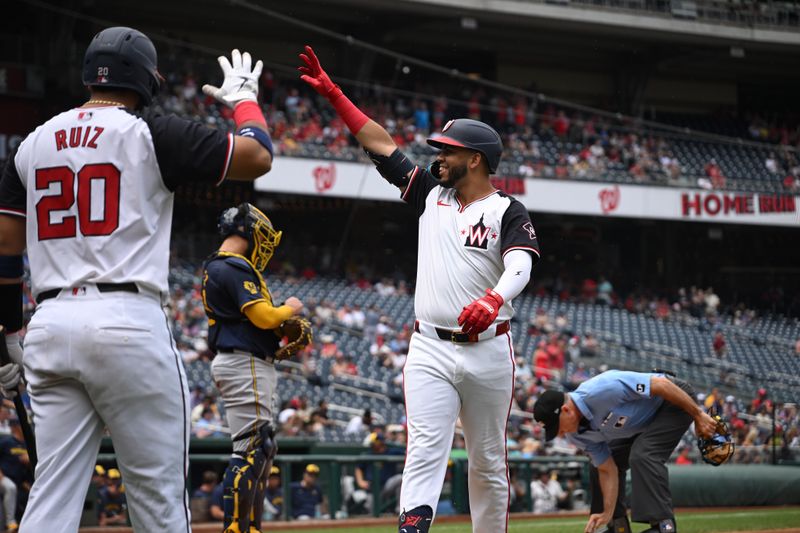 Aug 4, 2024; Washington, District of Columbia, USA; Washington Nationals second baseman Luis Garcia Jr. (2) reacts at home plate after hitting a home run against the Milwaukee Brewers during the first inning at Nationals Park. Mandatory Credit: Rafael Suanes-USA TODAY Sports