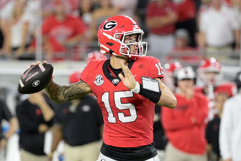 Nov 2, 2024; Jacksonville, Florida, USA; Georgia Bulldogs quarterback Carson Beck (15) passes the ball against the Florida Gators during the fourth quarter at EverBank Stadium. Mandatory Credit: Melina Myers-Imagn Images