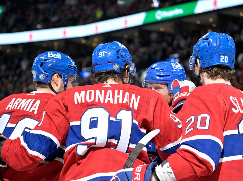 Jan 25, 2024; Montreal, Quebec, CAN; Montreal Canadiens forward Sean Monahan (91) celebrates with teammates after scoring a goal against the New York Islanders during the first period at the Bell Centre. Mandatory Credit: Eric Bolte-USA TODAY Sports