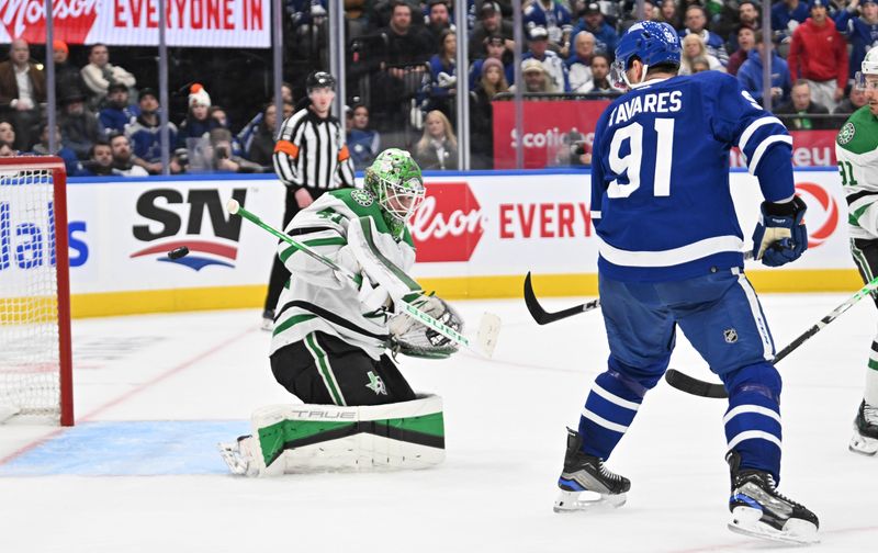 Feb 7, 2024; Toronto, Ontario, CAN; Dallas Stars goalie Scott Wedgewood (41) makes a save on a shot re-directed by Toronto Maple Leafs forward John Tavares (91) in the third period at Scotiabank Arena. Mandatory Credit: Dan Hamilton-USA TODAY Sports