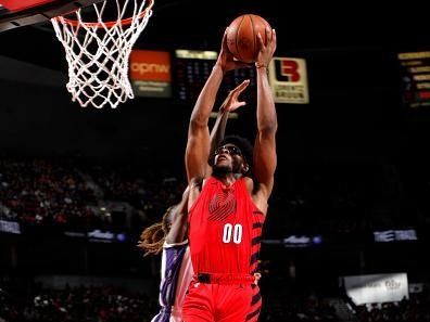 PORTLAND, OR - DECEMBER 26: Scoot Henderson #00 of the Portland Trail Blazers drives to the basket during the game against the Sacramento Kings on December 26, 2023 at the Moda Center Arena in Portland, Oregon. NOTE TO USER: User expressly acknowledges and agrees that, by downloading and or using this photograph, user is consenting to the terms and conditions of the Getty Images License Agreement. Mandatory Copyright Notice: Copyright 2023 NBAE (Photo by Cameron Browne/NBAE via Getty Images)