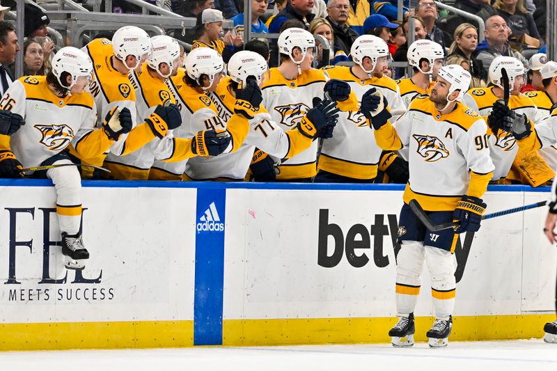 Nov 24, 2023; St. Louis, Missouri, USA;  Nashville Predators center Ryan O'Reilly (90) is congratulated by teammates after scoring against the St. Louis Blues during the second period at Enterprise Center. Mandatory Credit: Jeff Curry-USA TODAY Sports