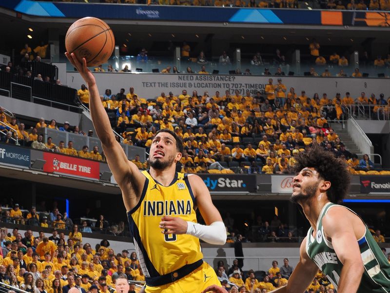 INDIANAPOLIS, IN - APRIL 26:  Tyrese Haliburton #0 of the Indiana Pacers drives to the basket during the game against the Milwaukee Bucks during Round 1 Game 3 of the 2024 NBA Playoffs on April 26, 2024 at Gainbridge Fieldhouse in Indianapolis, Indiana. NOTE TO USER: User expressly acknowledges and agrees that, by downloading and or using this Photograph, user is consenting to the terms and conditions of the Getty Images License Agreement. Mandatory Copyright Notice: Copyright 2024 NBAE (Photo by Ron Hoskins/NBAE via Getty Images)