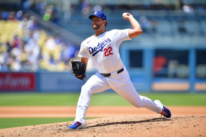 Jul 25, 2024; Los Angeles, California, USA; Los Angeles Dodgers starting pitcher Clayton Kershaw (22) throws against the San Francisco Giants during the fourth inning at Dodger Stadium. Mandatory Credit: Gary A. Vasquez-USA TODAY Sports