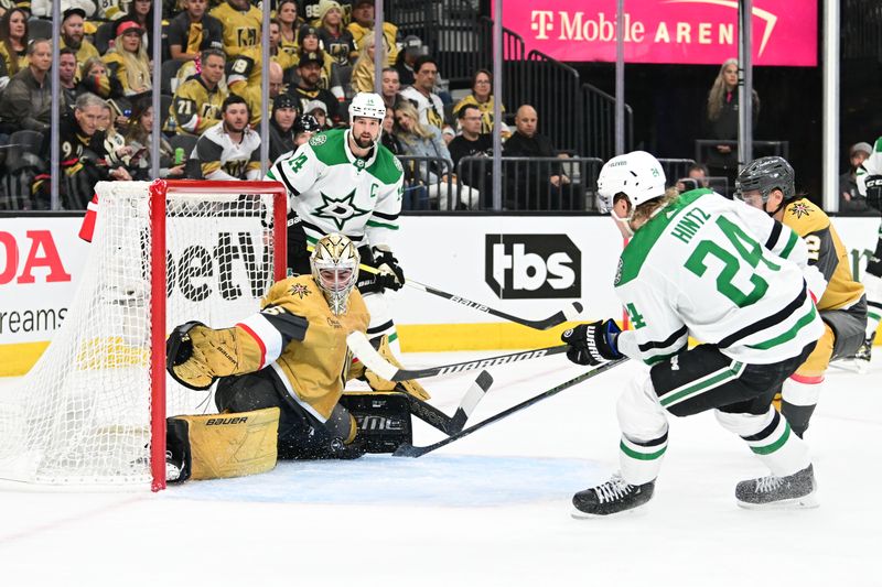 Apr 27, 2024; Las Vegas, Nevada, USA; Vegas Golden Knights goaltender Logan Thompson (36) stops a shot from Dallas Stars center Roope Hintz (24) in the second period in game three of the first round of the 2024 Stanley Cup Playoffs at T-Mobile Arena. Mandatory Credit: Candice Ward-USA TODAY Sports