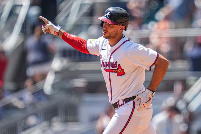 Aug 25, 2024; Cumberland, Georgia, USA; Atlanta Braves first baseman Matt Olson (28) reacts after hitting a home run against the Washington Nationals during the sixth inning at Truist Park. Mandatory Credit: Dale Zanine-USA TODAY Sports