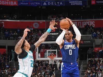 LOS ANGELES, CA - DECEMBER 26:  Russell Westbrook #0 of the LA Clippers shoots a three point basket during the game  on December 26, 2023 at Crypto.Com Arena in Los Angeles, California. NOTE TO USER: User expressly acknowledges and agrees that, by downloading and/or using this Photograph, user is consenting to the terms and conditions of the Getty Images License Agreement. Mandatory Copyright Notice: Copyright 2023 NBAE (Photo by Juan Ocampo/NBAE via Getty Images)