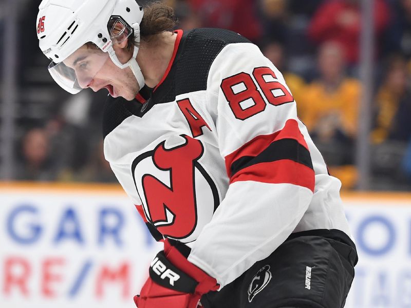 Jan 26, 2023; Nashville, Tennessee, USA; New Jersey Devils center Jack Hughes (86) celebrate after a goal during the second period against the Nashville Predators at Bridgestone Arena. Mandatory Credit: Christopher Hanewinckel-USA TODAY Sports