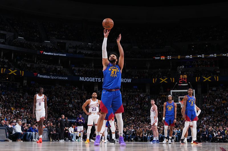 DENVER, CO - MARCH 5: Jamal Murray #27 of the Denver Nuggets shoots a free throw during the game against the Phoenix Suns on March 5, 2024 at the Ball Arena in Denver, Colorado. NOTE TO USER: User expressly acknowledges and agrees that, by downloading and/or using this Photograph, user is consenting to the terms and conditions of the Getty Images License Agreement. Mandatory Copyright Notice: Copyright 2024 NBAE (Photo by Garrett Ellwood/NBAE via Getty Images)