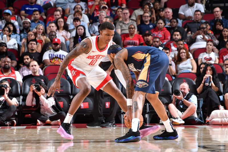 HOUSTON, TX - OCTOBER 15: Jabari Smith Jr. #10 of the Houston Rockets plays defense during the game against the New Orleans Pelicans during a NBA preseason game on October 15, 2024 at the Toyota Center in Houston, Texas. NOTE TO USER: User expressly acknowledges and agrees that, by downloading and or using this photograph, User is consenting to the terms and conditions of the Getty Images License Agreement. Mandatory Copyright Notice: Copyright 2024 NBAE (Photo by Logan Riely/NBAE via Getty Images)