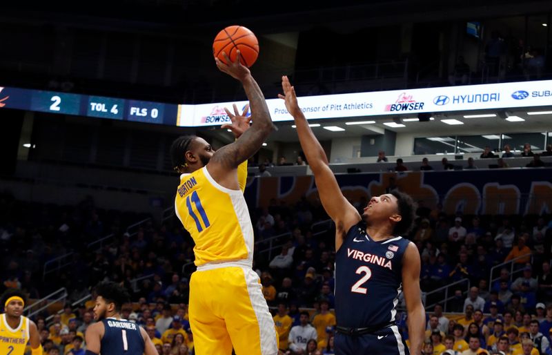 Jan 3, 2023; Pittsburgh, Pennsylvania, USA; Pittsburgh Panthers guard Jamarius Burton (11) shoots against Virginia Cavaliers guard Reece Beekman (2) during the first half at the Petersen Events Center. Mandatory Credit: Charles LeClaire-USA TODAY Sports