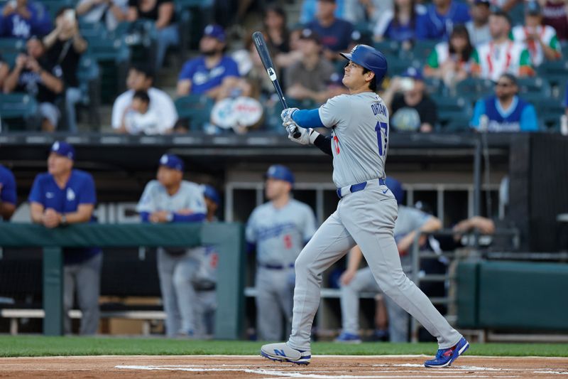 Jun 26, 2024; Chicago, Illinois, USA; Los Angeles Dodgers designated hitter Shohei Ohtani (17) watches his solo home run against the Chicago White Sox during the first inning at Guaranteed Rate Field. Mandatory Credit: Kamil Krzaczynski-USA TODAY Sports