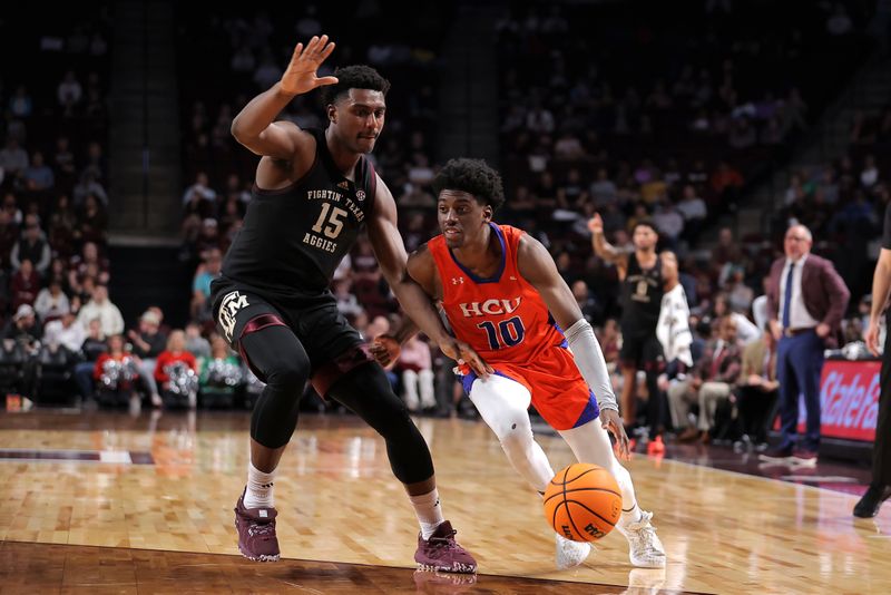 Dec 22, 2023; College Station, Texas, USA; Houston Christian Huskies guard Marcus Greene (10) drives to the basket against Texas A&M Aggies forward Henry Coleman III (15) during the second half at Reed Arena. Mandatory Credit: Erik Williams-USA TODAY Sports