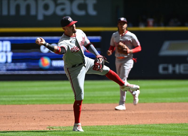 Sep 17, 2023; Milwaukee, Wisconsin, USA; Washington Nationals shortstop Ildemaro Vargas (14) throws the ball to first base for an out against the Milwaukee Brewers in the first inning at American Family Field. Mandatory Credit: Michael McLoone-USA TODAY Sports