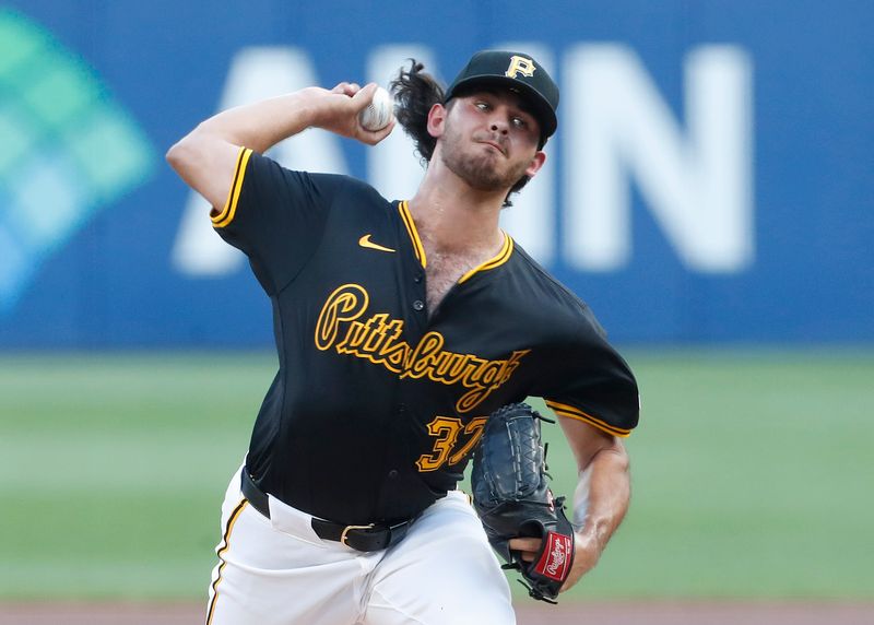 Aug 27, 2024; Pittsburgh, Pennsylvania, USA;  Pittsburgh Pirates starting pitcher Jared Jones (37) delivers a pitch against the Chicago Cubs during the first inning at PNC Park. Mandatory Credit: Charles LeClaire-USA TODAY Sports