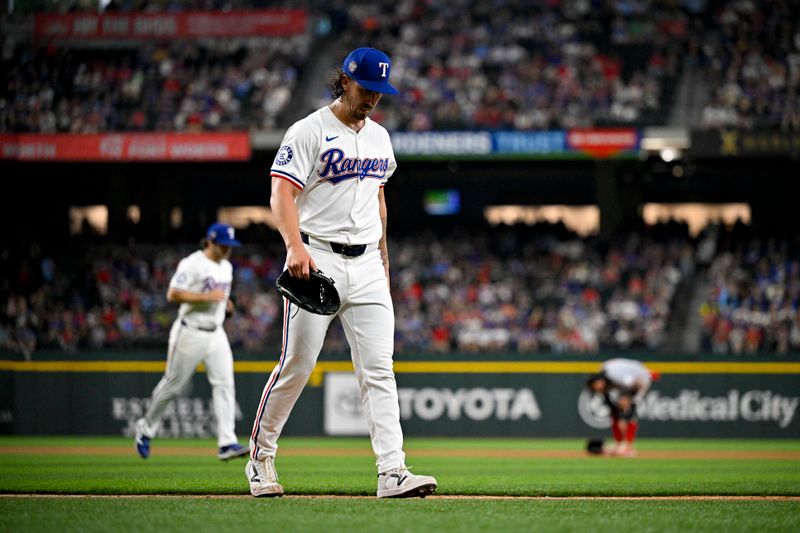 Apr 27, 2024; Arlington, Texas, USA; Texas Rangers starting pitcher Michael Lorenzen (23) comes off the field after pitching against the Cincinnati Reds during the second inning at Globe Life Field. Mandatory Credit: Jerome Miron-USA TODAY Sports