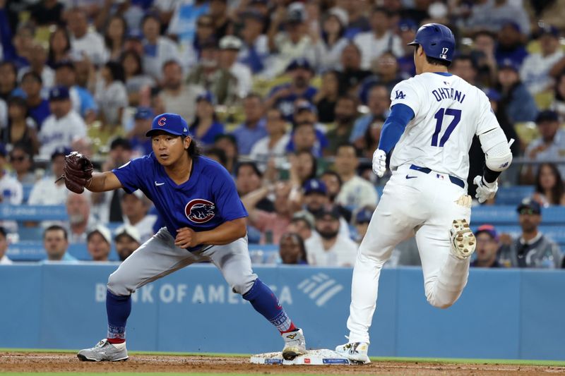 Sep 10, 2024; Los Angeles, California, USA;  Los Angeles Dodgers designated hitter Shohei Ohtani (17) grounds into a double play as Chicago Cubs starting pitcher Shota Imanaga (18) complete a double play at first base during the third inning against the Chicago Cubs at Dodger Stadium. Mandatory Credit: Kiyoshi Mio-Imagn Images