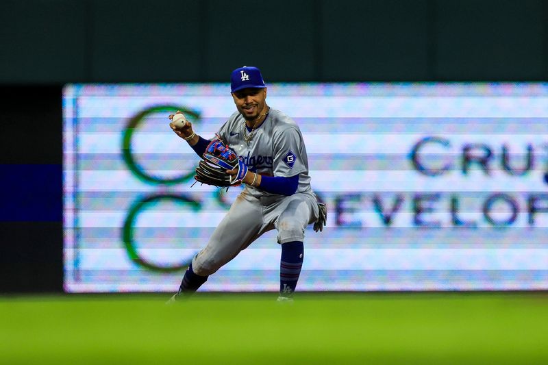 May 25, 2024; Cincinnati, Ohio, USA; Los Angeles Dodgers shortstop Mookie Betts (50) fields the ball hit by Cincinnati Reds pinch hitter Stuart Fairchild (not pictured) in the seventh inning at Great American Ball Park. Mandatory Credit: Katie Stratman-USA TODAY Sports