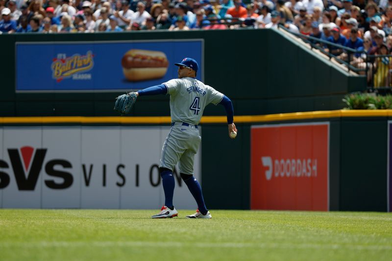 May 25, 2024; Detroit, Michigan, USA; Toronto Blue Jays outfielder George Springer (4) throws to the infield during the first inning of the game against the Detroit Tigers at Comerica Park. Mandatory Credit: Brian Bradshaw Sevald-USA TODAY Sports