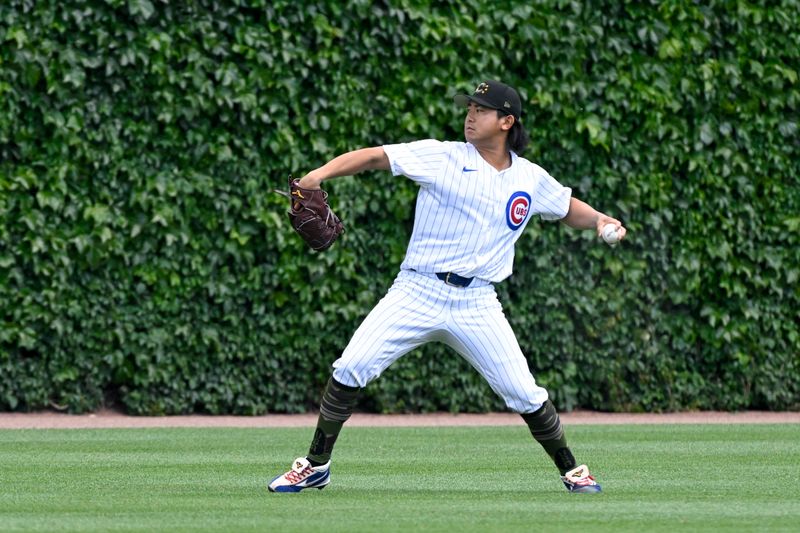 May 18, 2024; Chicago, Illinois, USA; Chicago Cubs pitcher Shota Imanaga (18) warms up before the team’s game against the Pittsburgh Pirates at Wrigley Field. Mandatory Credit: Matt Marton-USA TODAY Sports