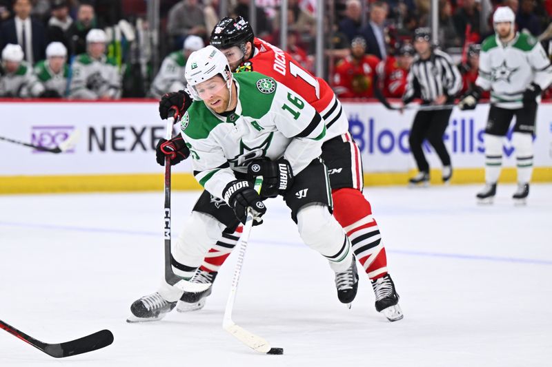 Jan 13, 2024; Chicago, Illinois, USA;  Dallas Stars forward Joe Pavelski (16) controls the puck while being pursued by Chicago Blackhawks forward Jason Dickinson (16) in the second period at United Center. Mandatory Credit: Jamie Sabau-USA TODAY Sports