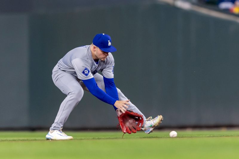 Apr 9, 2024; Minneapolis, Minnesota, USA; Los Angeles Dodgers second baseman Gavin Lux (9) fields a ground ball against the Minnesota Twins in the seventh inning at Target Field. Mandatory Credit: Jesse Johnson-USA TODAY Sports