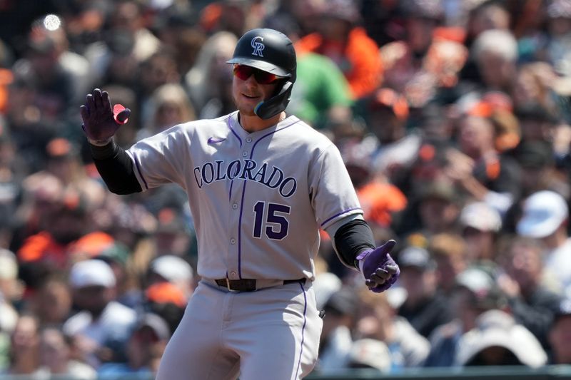 May 3, 2025; San Francisco, California, USA; Colorado Rockies catcher Hunter Goodman (15) reacts after hitting an RBI-single against the San Francisco Giants during the sixth inning at Oracle Park. Mandatory Credit: Darren Yamashita-Imagn Images