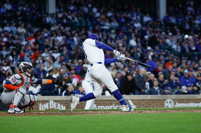 Apr 23, 2024; Chicago, Illinois, USA; Chicago Cubs outfielder Mike Tauchman (40) hits a three-run home run against the Houston Astros during the first inning at Wrigley Field. Mandatory Credit: Kamil Krzaczynski-USA TODAY Sports