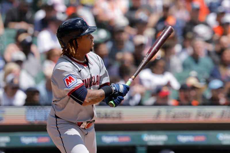 May 25, 2025; Detroit, Michigan, USA;  Cleveland Guardians designated hitter José Ramírez (11) hits a single in the seventh inning against the Detroit Tigers at Comerica Park. Mandatory Credit: Rick Osentoski-Imagn Images