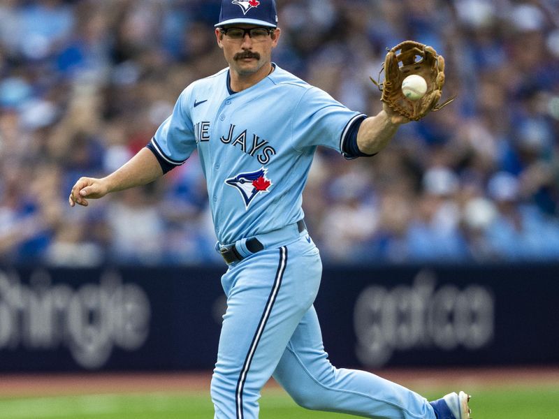 Aug 12, 2023; Toronto, Ontario, CAN; Toronto Blue Jays second baseman Davis Schneider (36) makes a catch against the Chicago Cubs during the seventh inning at Rogers Centre. Mandatory Credit: Kevin Sousa-USA TODAY Sports