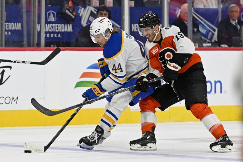 Dec 3, 2025; Philadelphia, Pennsylvania, USA;  Buffalo Sabres center Josh Dunne (44) carries the puck into the zone against Philadelphia Flyers right wing Garnet Hathaway (19) during the first period at Xfinity Mobile Arena. Mandatory Credit: Eric Hartline-Imagn Images