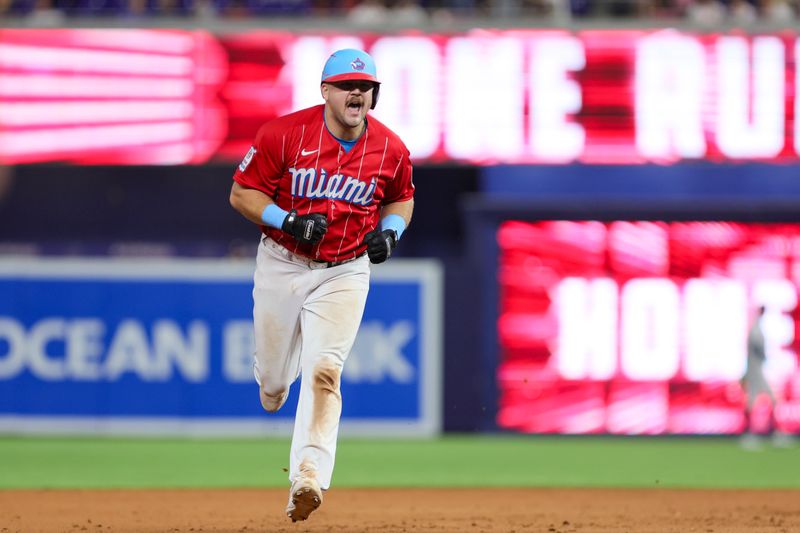 Sep 16, 2023; Miami, Florida, USA; Miami Marlins third baseman Jake Burger (36) reacts after hitting a two-run home run against the Atlanta Braves during the eighth inning at loanDepot Park. Mandatory Credit: Sam Navarro-USA TODAY Sports