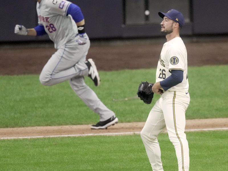 Oct 1, 2024; Milwaukee, Wisconsin, USA; New York Mets designated hitter J.D. Martinez (28) hits a two-run RBI single off of Milwaukee Brewers pitcher Aaron Ashby during the fifth inning of their wild-card playoff game at American Family Field. Mandatory Credit: Mark Hoffman/USA TODAY Network via Imagn Images